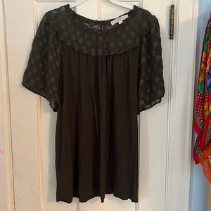 Gently used olive blouse with sheer neck and sleeves featuring textured dots